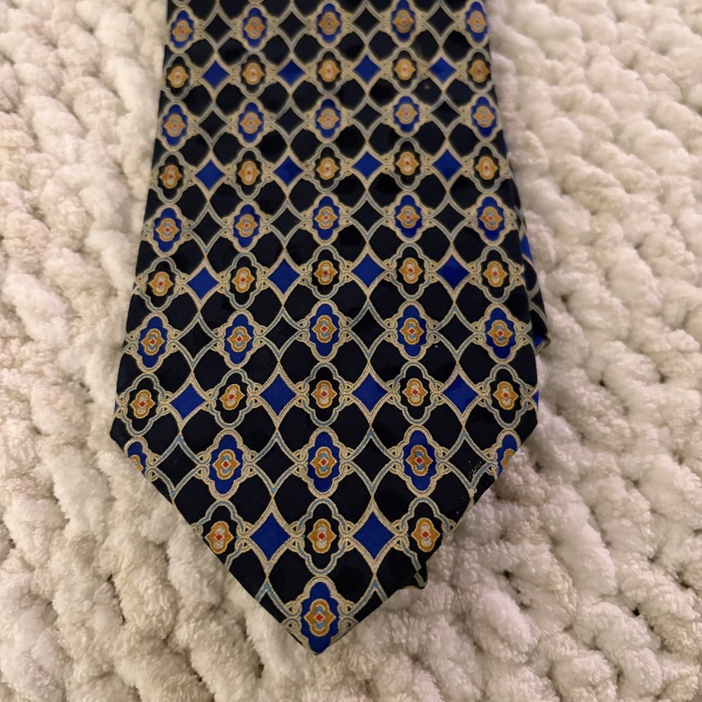 Art Deco-style geometric medallion crest pattern Blue Gold Red Silk italy